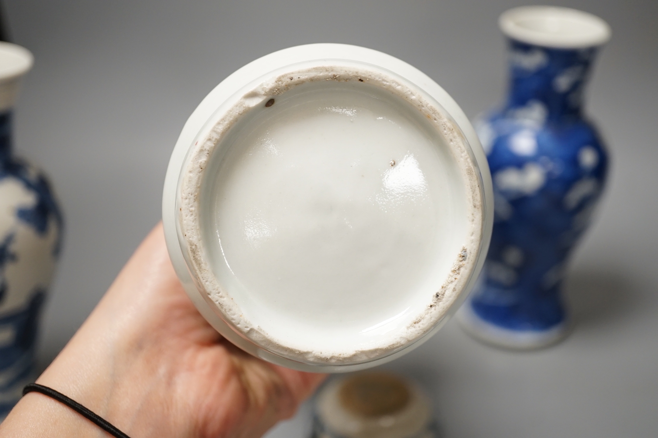 A Japanese Edo period Imari vase, 22. 5 cm, two 19th-century Chinese blue and white baluster vases, an Annamese blue and white box and cover, a Chinese famille rose plates and a blue and white dish